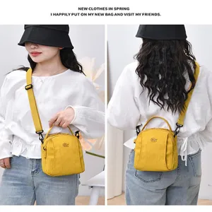 Lightweight nylon crossbody bag for women, multi-layer casual shoulder bag, bright yellow.