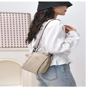 Casual nylon crossbody bag for women, lightweight multi-layer small shoulder bag stylish.