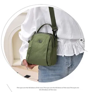 Lightweight nylon crossbody bag for women, casual multi-layer shoulder bag with top handle.