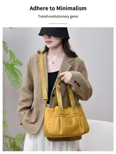 Fashionable large capacity waterproof tote shoulder crossbody bag for women daily use.