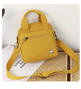 Yellow canvas crossbody bag, casual phone shoulder bag with handle, perfect for outdoor travel.