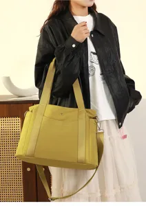 Detail view of the large capacity oxford cloth shoulder tote bag in stylish green finish.