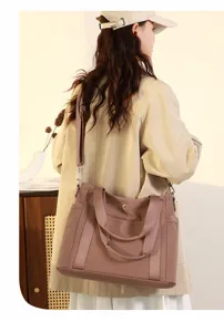Detail shot of large capacity women shoulder tote bag made with durable oxford fabric material.