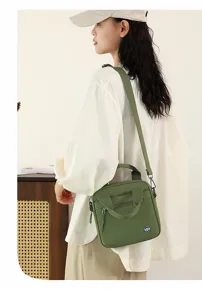 Green canvas crossbody bag for women, casual shoulder bag with top handle and zipper pocket.
