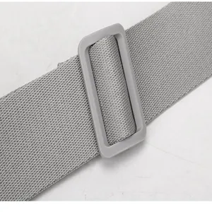 Detailed view of the durable grey adjustable shoulder strap and buckle for casual daily bags.