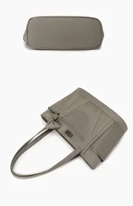 Grey canvas tote bag with bow detail, large capacity casual commuting handbag detail view.