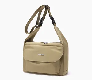 Detailed view of the casual khaki crossbody bag, showing adjustable strap and front flap design.