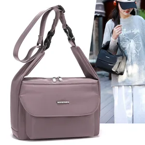 Minimalist women's large capacity lightweight crossbody shoulder bag for daily commuting and travel.