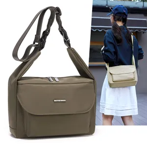 Minimalist large capacity crossbody bag for women, lightweight commuter shoulder bag.