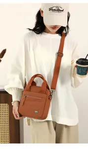 Casual canvas shoulder bag for women, lightweight crossbody handbag with multi-pockets.