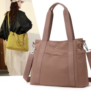 Large capacity Oxford cloth tote bag for women, stylish shoulder and crossbody commuting bag.