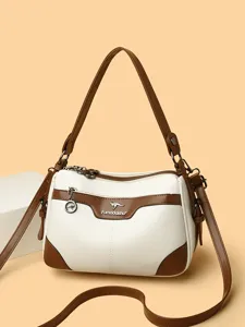 Stylish women's white and brown crossbody shoulder bag with contrast PU leather trim.