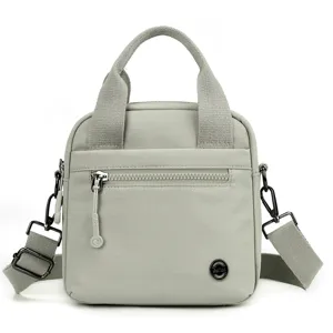 Lightweight casual canvas crossbody bag for women, portable shoulder bag for daily commute.