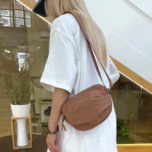 Casual solid color crossbody bag for women, trendy minimalist nylon shoulder bag, daily use.