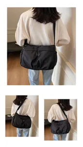 Vue détaillée du sac porté épaule noir en nylon décontracté, grande capacité pour travail.