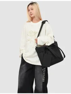Black multi-compartment tote bag with insulated lunch compartment and shoulder strap for daily work.