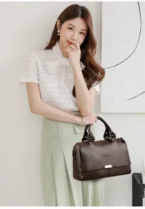 Dark brown leather handbag for women, large capacity commuter tote bag with metal clasp.