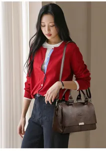 Detailed view of the stylish brown leather shoulder handbag, featuring large capacity design.