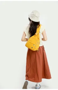 Yellow casual sling chest bag worn by model, showing practical daily wear detail.