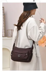 Casual brown multi-pocket nylon crossbody shoulder bag, ideal for daily commute.