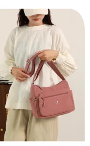 Casual nylon crossbody shoulder bag for women, lightweight travel commuter handbag.