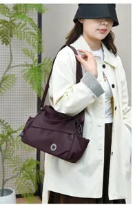 Fashion minimalist nylon shoulder crossbody bag for women, casual daily travel handbag style.