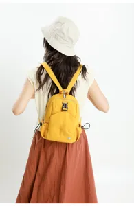 Casual yellow backpack for women, lightweight oxford fabric school bag for daily travel.