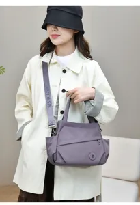 Detail view of the stylish nylon tote bag, showcasing its large capacity and durable strap.