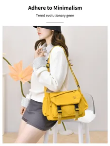 Yellow minimalist crossbody messenger bag detail, featuring large capacity and functional design.