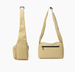Detail view of khaki nylon crossbody bag featuring adjustable strap and secure zip pocket design.