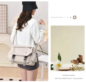Trendy Japanese canvas messenger bag with large capacity, durable crossbody design for students.
