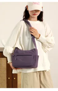 Casual purple nylon shoulder bag for women, stylish cross-body travel commuting handbag.