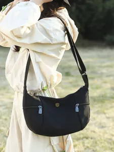 Casual canvas cross-body bag for women, large capacity minimalist shoulder bag for daily use.