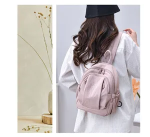 Zaino casual rosa elegante da donna, zainetto impermeabile leggero per uso quotidiano.
