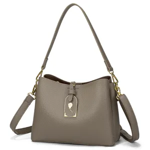 Gray leather shoulder bag for women, stylish underarm commuter handbag with large capacity.