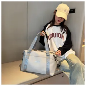 Large capacity travel duffel bag for women, waterproof multi-functional gym shoulder bag.