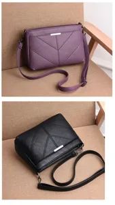 Detailed view of the women's soft leather crossbody bag with chic stitching and metal accent.
