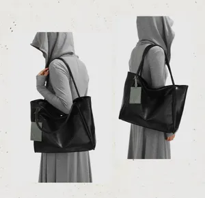 Minimalist black leather tote bag for women, large capacity shoulder bag for daily commute.