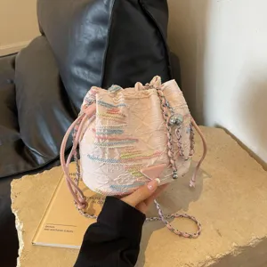 Stylish pink bucket bag with colorful embroidery and chain strap for women fashionable daily wear