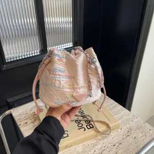 Pink woven bucket bag with chain strap stylish casual fashion shoulder bag for women daily use