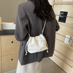 Fashion quilted bucket bag for women, casual crossbody bag with chain strap and colorful embroidery.