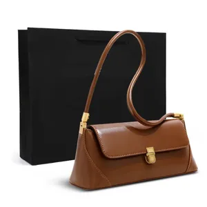 Brown leather shoulder bag for women, stylish underarm handbag with gold metal lock.