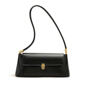 Detailed view of the black leather shoulder bag showing its elegant metal clasp and arch strap.