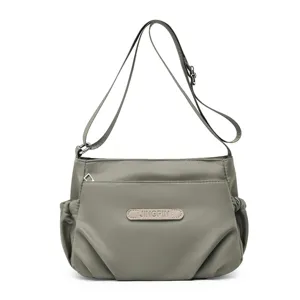 Women casual nylon crossbody bag, lightweight multi-pocket shoulder bag for travel.