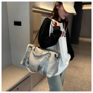 Large capacity travel duffel bag for women, multi-functional waterproof gym and shoulder bag.