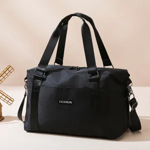 Black large capacity travel duffel bag with handles and shoulder strap for fitness.