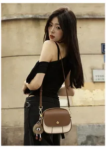 Stylish color-block crossbody bag for women, mini soft leather shoulder bag with chic design.