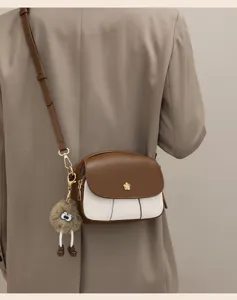 Chic color-blocked mini crossbody bag for women, soft leather, stylish and versatile detail.