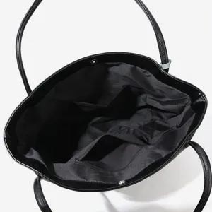 Large capacity black tote bag for women, stylish commuter handbag with dual shoulder handles.