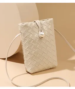 Beige woven leather crossbody phone bag with pearl closure, stylish mini shoulder bag.